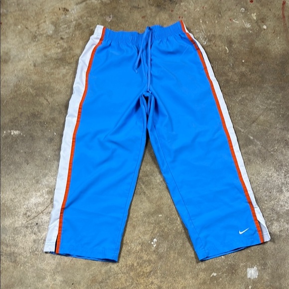 Vintage Nike Cropped Blue Pants with Orange and White Stripes
Size: small - Picture 1 of 7